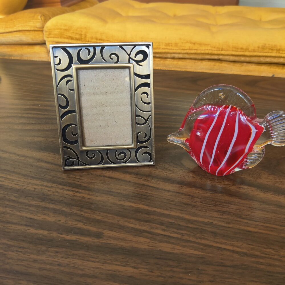 Bronze Abstract Picture Frame And Glass Blown Fish With Red Stripes.